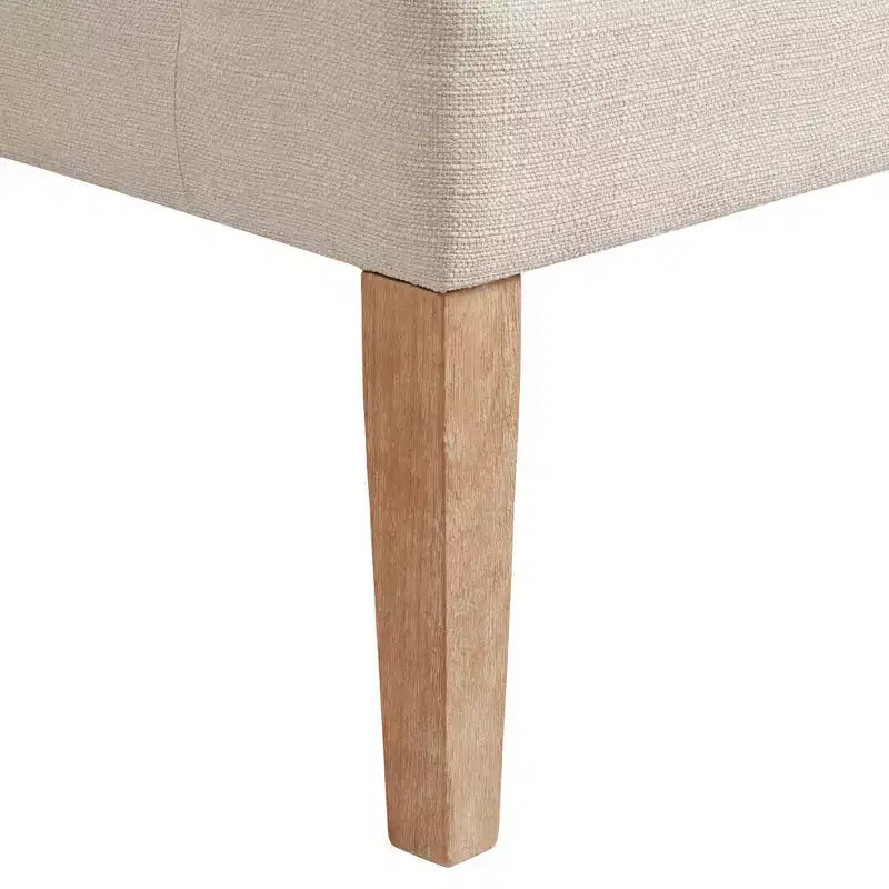 Poltrona Dixon Ivory in tessuto con braccioli ricurvi